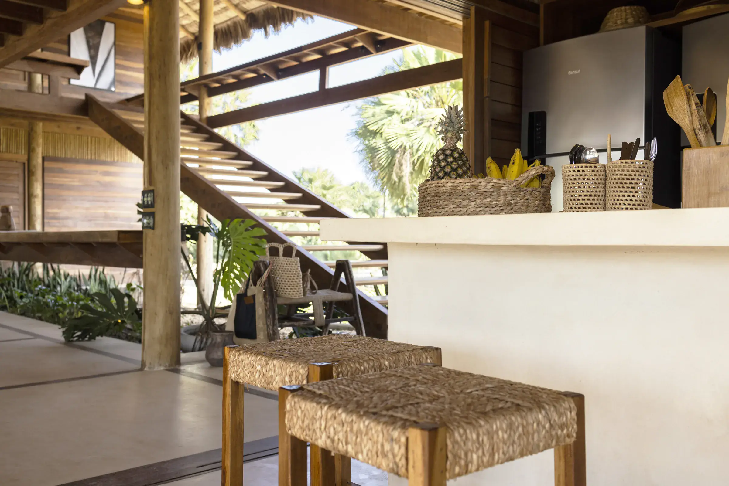 Casa Camuá — staircase and polished-concrete bar